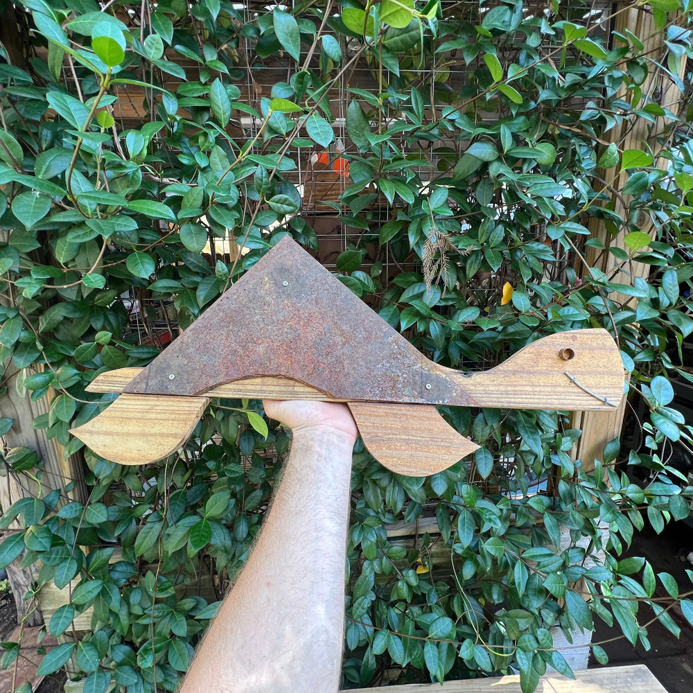 
                  
                    Front view of Turtle Wood Art II, highlighting its rusted steel shell and wooden body
                  
                