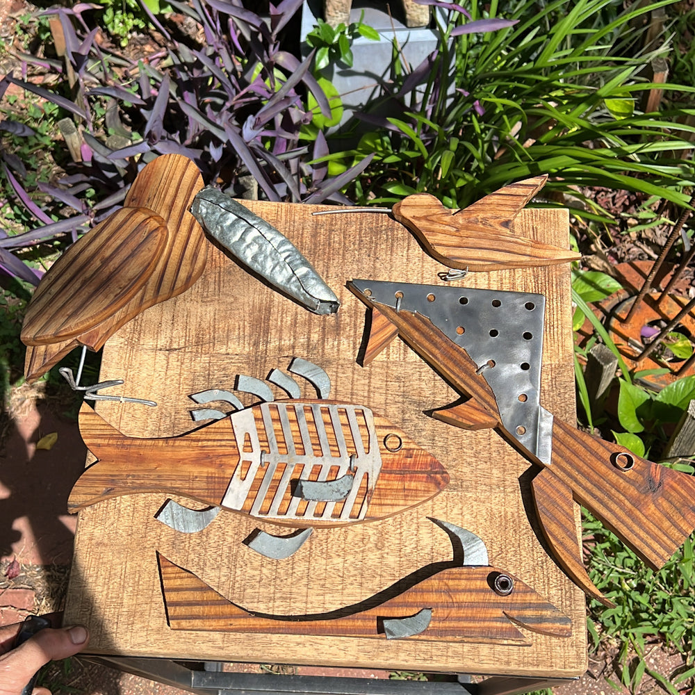 
                  
                    View of the handcrafted humming bird piece with other art pieces from the same collection.
                  
                